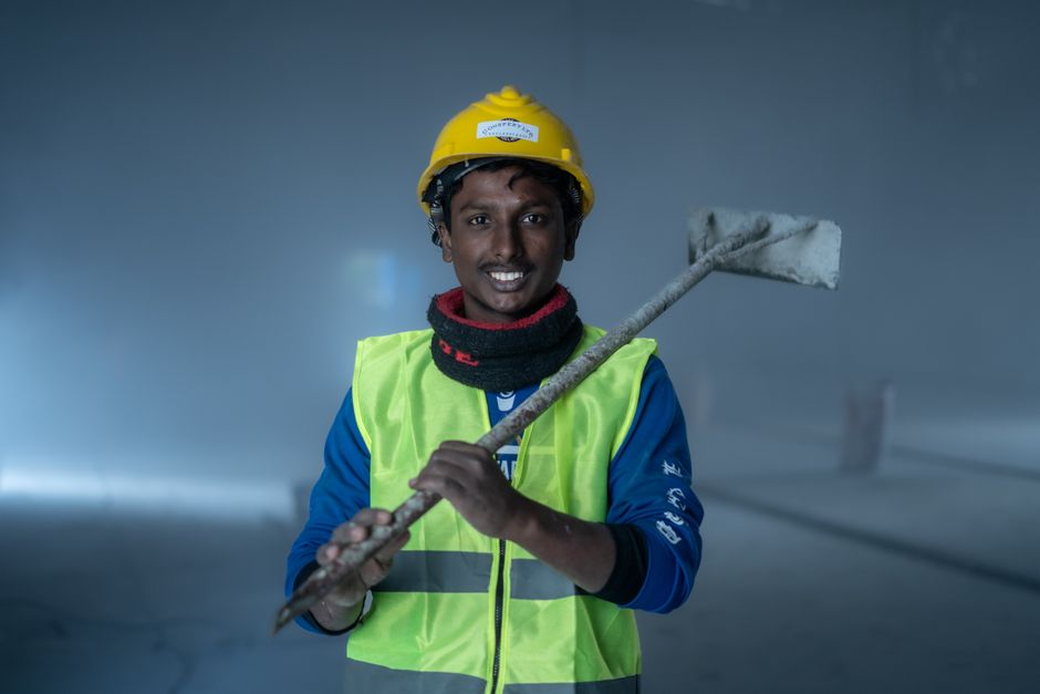 Friendly professional contractor pointing out structural alignment